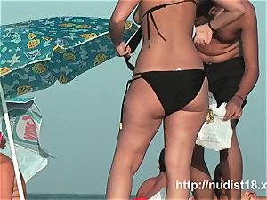 bare beach spycam movie of molten playful nudists in water